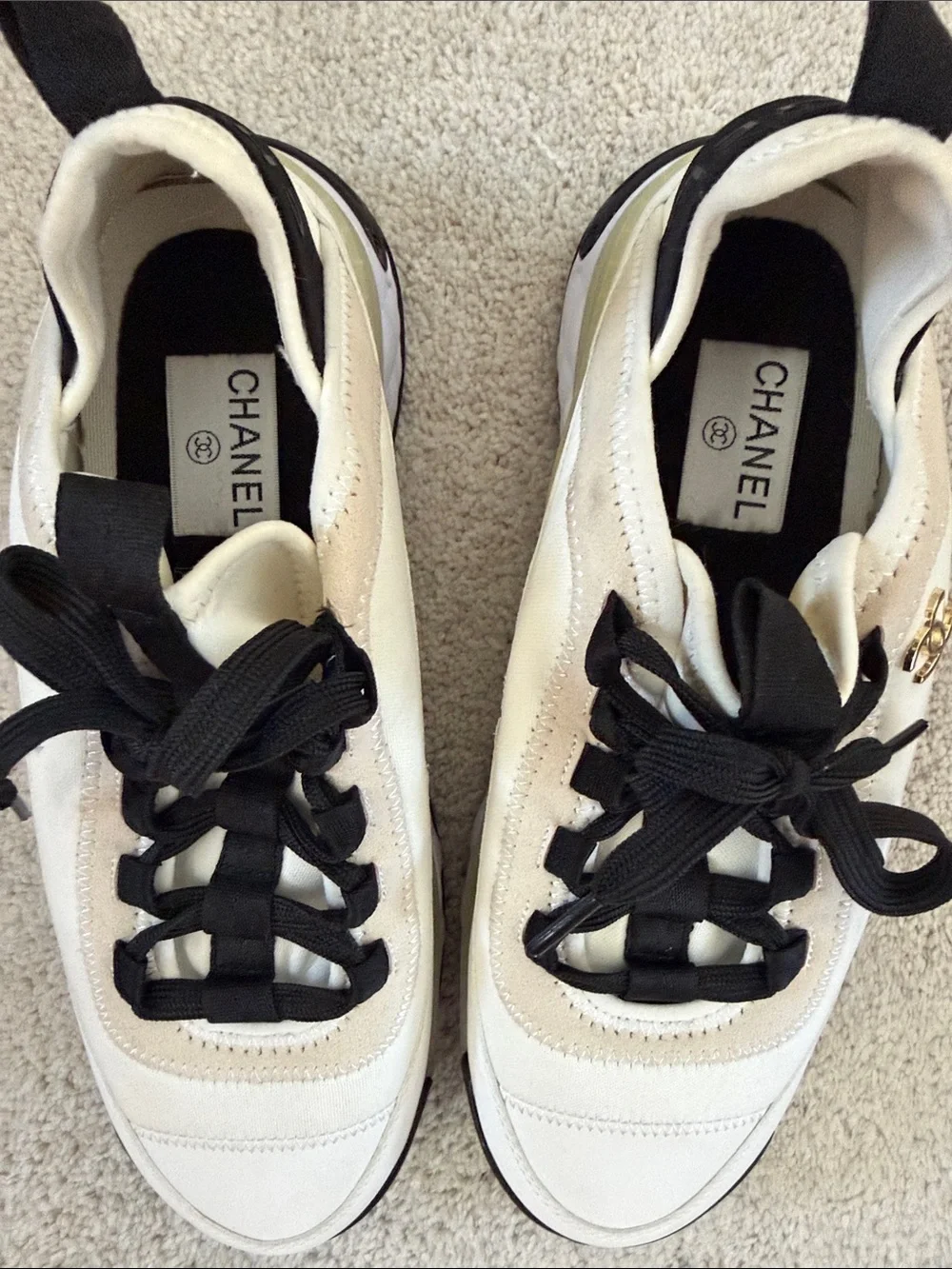 CHANEL Women’s Sneakers in White, Black and Cream
